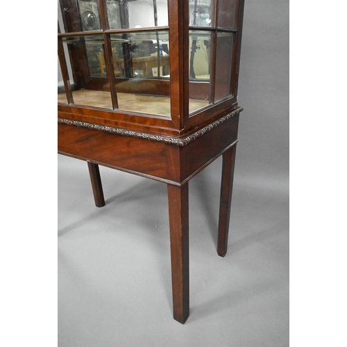 756 - A Georgian Chippendale style glazed mahogany display cabinet, raised on a converted mahogany card ta... 