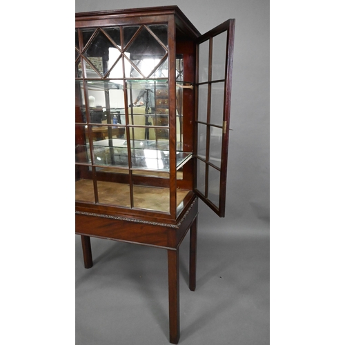 756 - A Georgian Chippendale style glazed mahogany display cabinet, raised on a converted mahogany card ta... 