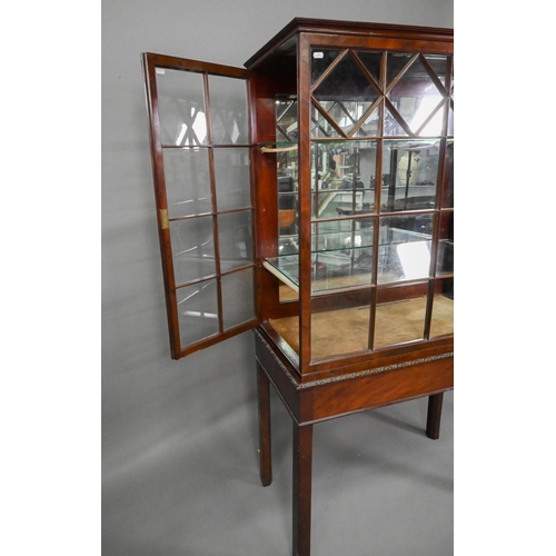 756 - A Georgian Chippendale style glazed mahogany display cabinet, raised on a converted mahogany card ta... 