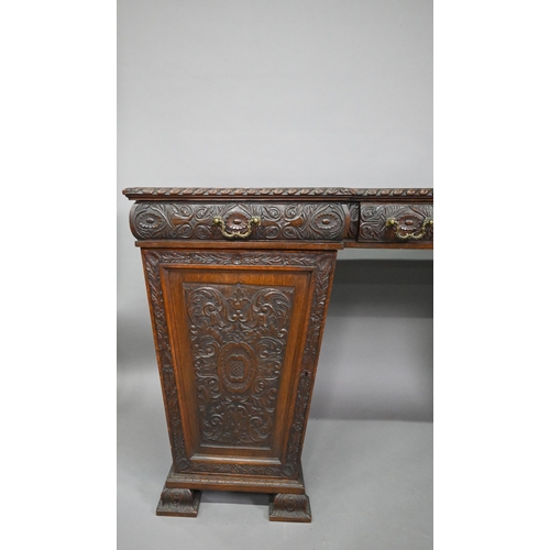 761 - A Victorian carved and moulded oak twin pedestal sideboard, the breakfront top over three frieze dra... 