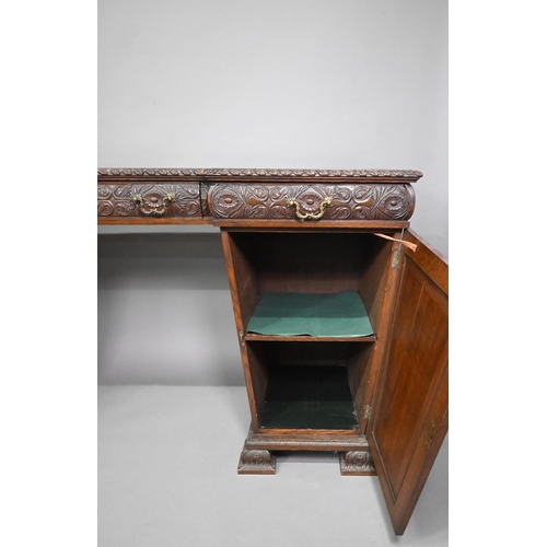 761 - A Victorian carved and moulded oak twin pedestal sideboard, the breakfront top over three frieze dra... 