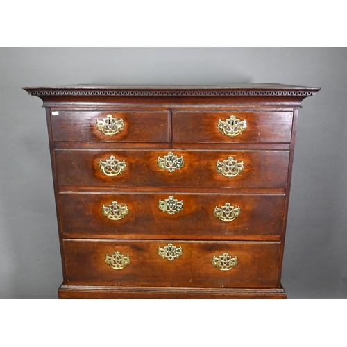 767 - An 18th century oak chest on stand comprising two short over four long graduated drawers, the stand ... 