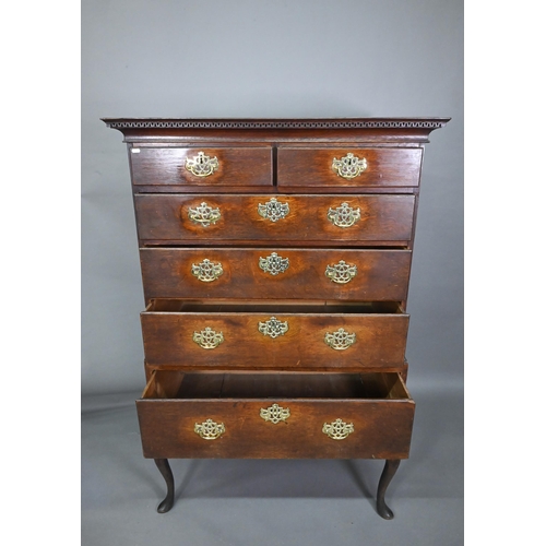 767 - An 18th century oak chest on stand comprising two short over four long graduated drawers, the stand ... 