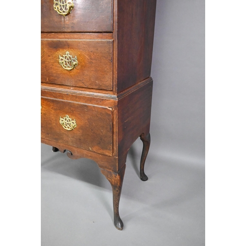 767 - An 18th century oak chest on stand comprising two short over four long graduated drawers, the stand ... 