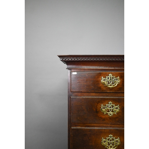 767 - An 18th century oak chest on stand comprising two short over four long graduated drawers, the stand ... 