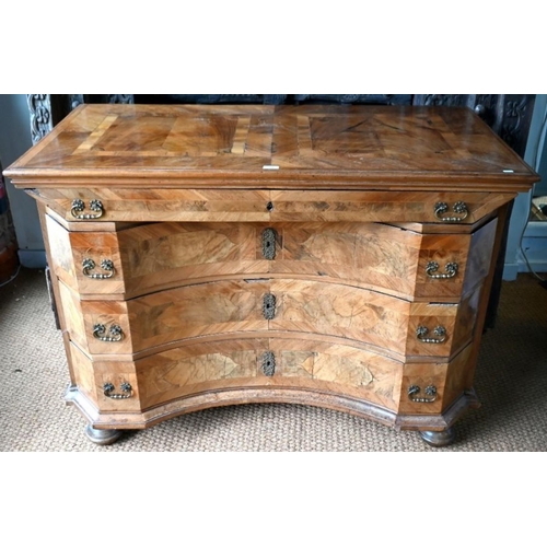 772 - An 18th century continental (South German) inlaid walnut commode, the full width frieze drawer over ... 