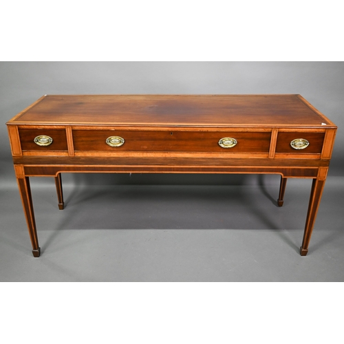 781 - A converted George III cross-banded mahogany spinet to a three drawer sideboard, raised on square ta... 