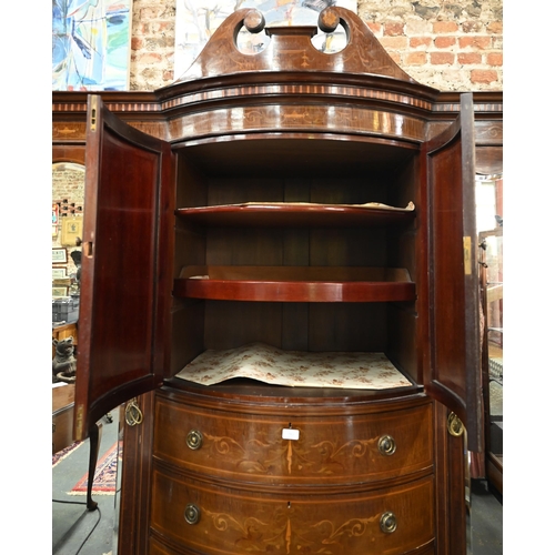 783 - A Victorian Sheraton Revival bowfront compactum, centred by a bowfront twin cupboard enclosing linen... 