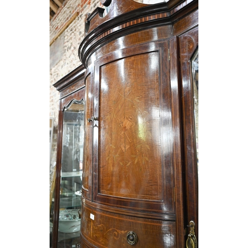 783 - A Victorian Sheraton Revival bowfront compactum, centred by a bowfront twin cupboard enclosing linen... 