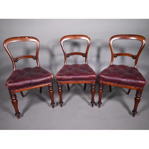 793A - A set of four mahogany framed balloon back dining side chairs, with overstuffed buttoned leather sea... 