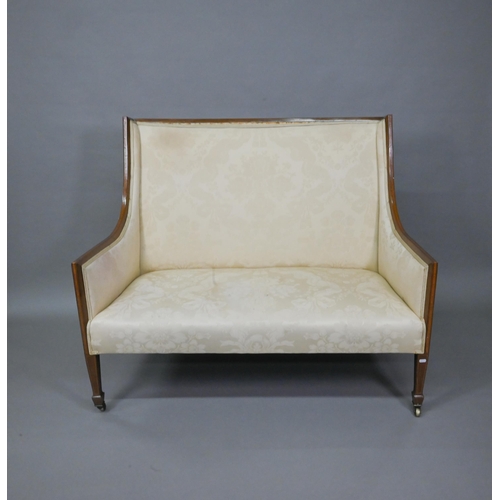 803 - A Sheraton Revival satinwood framed high back sofa, raised on square section front legs to brass cas... 