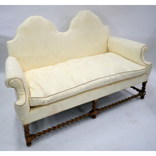 808 - A traditional Queen Anne style double hump-back sofa, raised on six oak barley twist legs united by ... 