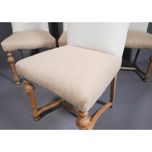 812 - A set of four traditional style high hump-back beech framed dining side chairs, upholstered in calic... 