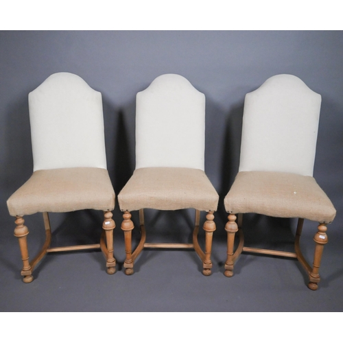 812 - A set of four traditional style high hump-back beech framed dining side chairs, upholstered in calic... 