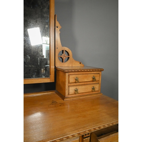 824 - A Victorian inlaid ash Aesthetic Movement mirror backed dressing chest, with an arrangement of nine ... 