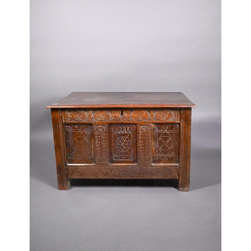 825 - An early 18th and later oak coffer, with lunette carved frieze over a trio of incised panels, on sti... 