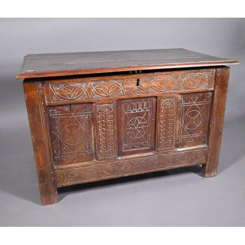 825 - An early 18th and later oak coffer, with lunette carved frieze over a trio of incised panels, on sti... 