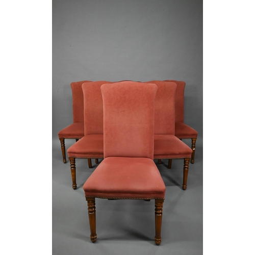 835 - A set of ten contemporary red and cream upholstered high back dining chairs, raised on turned front ... 