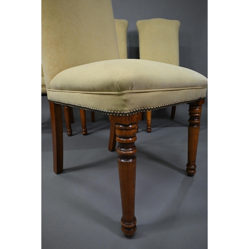 835 - A set of ten contemporary red and cream upholstered high back dining chairs, raised on turned front ... 