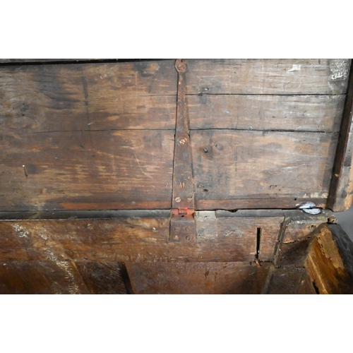 846 - A 17th century joint oak coffer, part carved, on stile feet 128 cm x 55 cm x 69 cm h