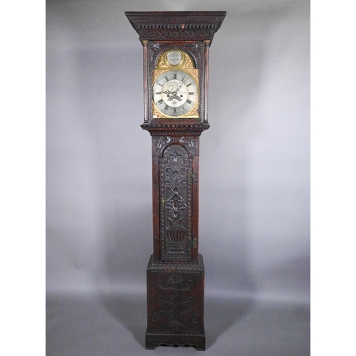 859 - Jarvis, Dalton, an 18th century and later carved oak clock, the eight day movement with arched brass... 