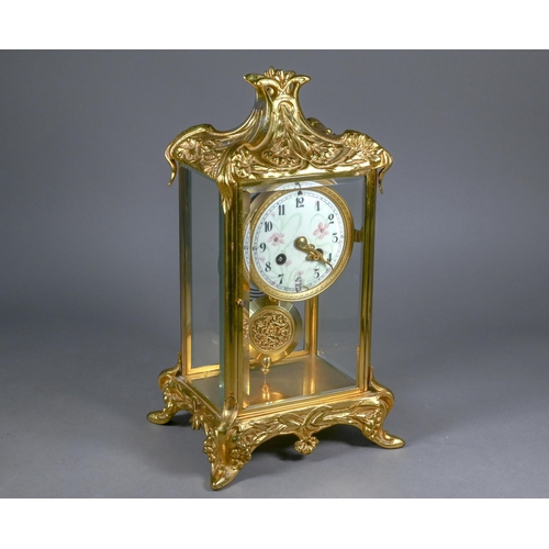 863 - A gilt metal four window mantel clock, the 8-day two train drum movement with white enamelled roman ... 