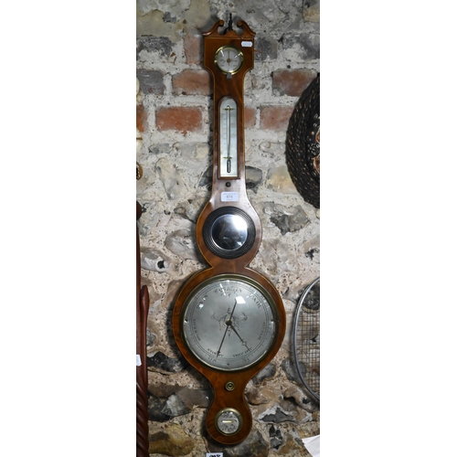 874 - A 19th century mahogany wheel barometer with silvered dial, thermometer, level centred by a convex p... 