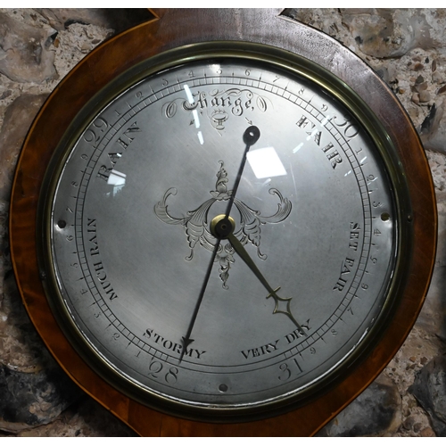 874 - A 19th century mahogany wheel barometer with silvered dial, thermometer, level centred by a convex p... 