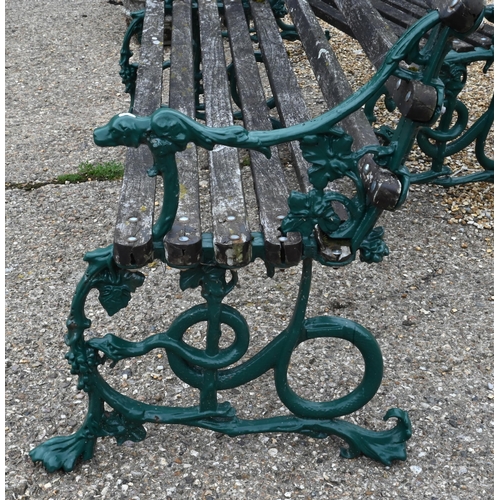 879 - A pair of Coalbrookdale serpent grape and dog design cast iron garden benches, with wood slat seats ... 