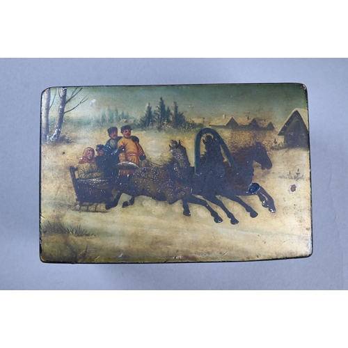 897 - A 19th century Russian lacquered papier maché tea caddy, the cover painted with a family in horse-dr... 