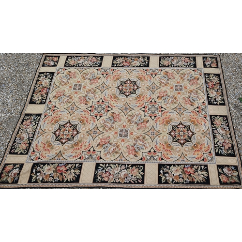 905 - A classic Aubusson style needlepoint rug, the floral design on ochre ground, 236 cm x 180 cm