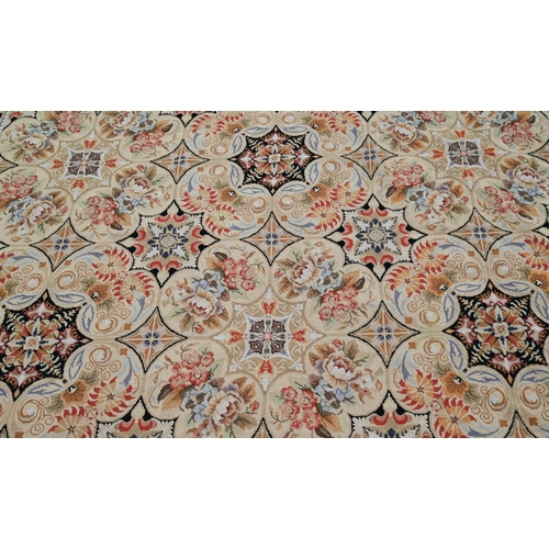 905 - A classic Aubusson style needlepoint rug, the floral design on ochre ground, 236 cm x 180 cm