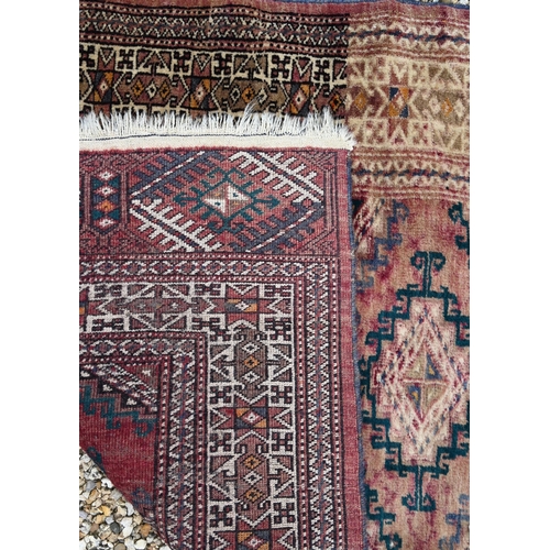 911 - An old Afghan washed red ground runner, 281 cm x 76 cm