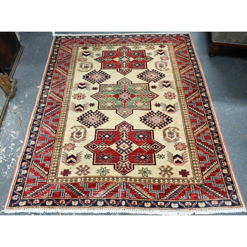 917 - A contemporary Turkish Caucasian design cream/red rug, triple pole lozenge, 180 cm x 148 cm