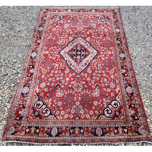 931 - A contemporary Persian Sarouk rug, centred by a diamond lozenge on red ground, 210 cm x 130 cm