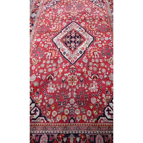 931 - A contemporary Persian Sarouk rug, centred by a diamond lozenge on red ground, 210 cm x 130 cm