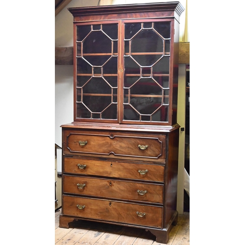 934 - A George III mahogany secretaire library bookcase, the pair of astragal glazed cabinet doors enclosi... 