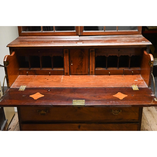 934 - A George III mahogany secretaire library bookcase, the pair of astragal glazed cabinet doors enclosi... 