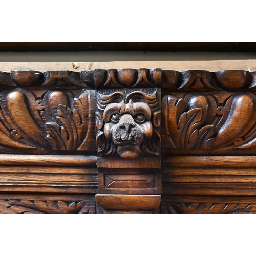 936 - A quantity of Victorian and later composed moulded and carved oak room panelling, incorporating a si... 