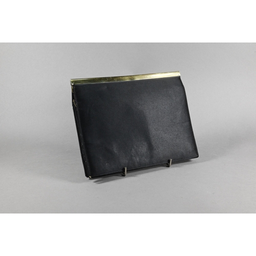 1131 - An Asprey black satin evening bag with silver gilt mount, London 1956 and green silk lining, 18 x 23... 