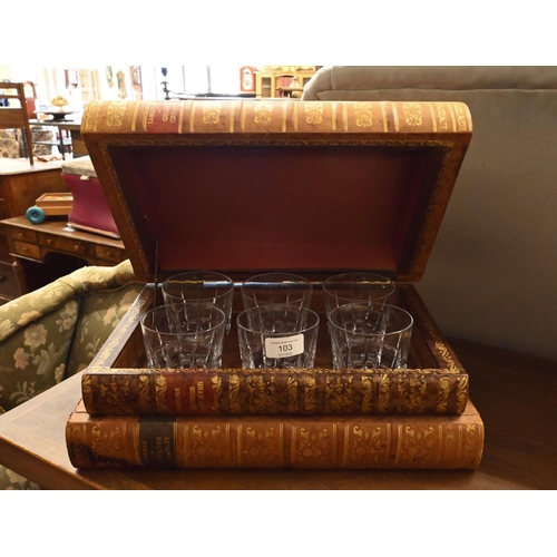 103 - A set of six cut glass whisky tumblers concealed in a stack of leather-bound books