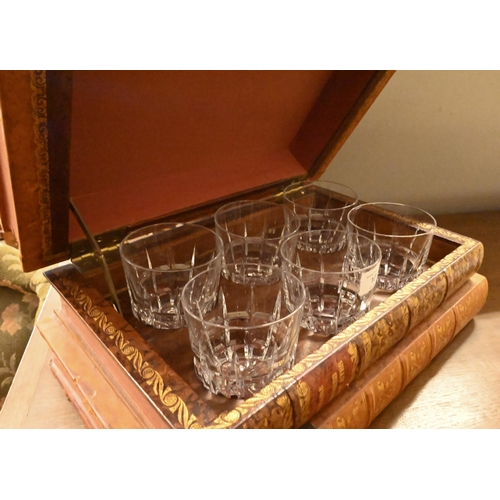 103 - A set of six cut glass whisky tumblers concealed in a stack of leather-bound books