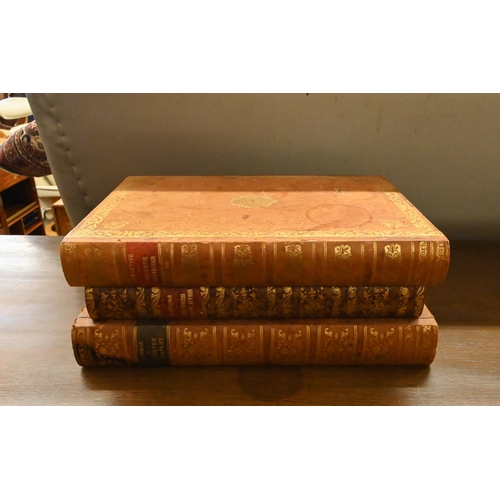 103 - A set of six cut glass whisky tumblers concealed in a stack of leather-bound books