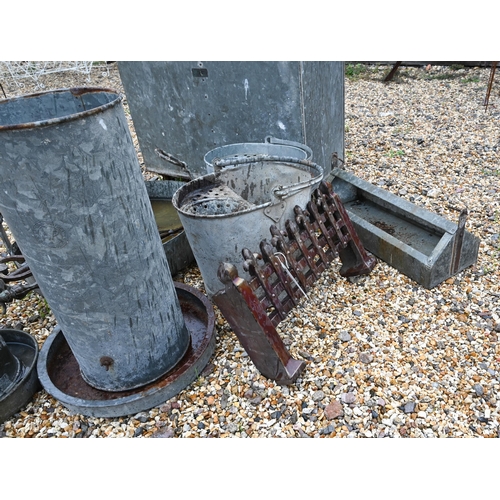 11 - An old galvanised two compartment feed trolley, on castors, to/w assorted galvanised feeders, bucket... 