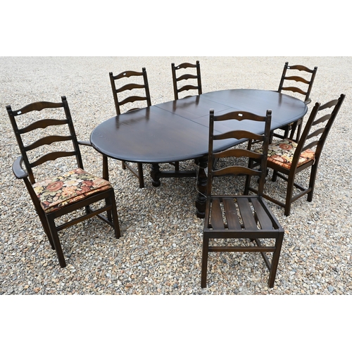 376 - #An Ercol Old Colonial extending dining table and set of six chairs (two carvers, four side) the tab... 