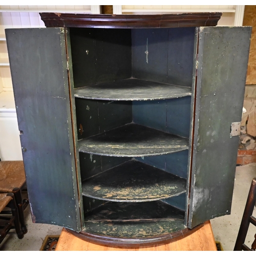 385 - #An 18th century flame mahogany barrel corner cupboard