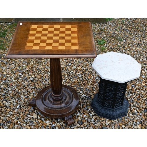 388 - A cast iron Victorian style greenhouse heater body with veined marble travertine top, to/w a chess b... 