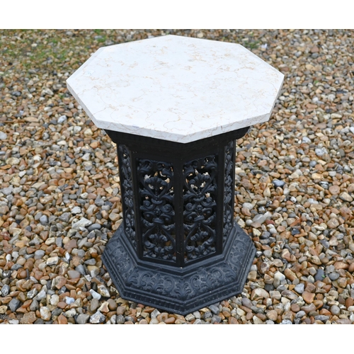 388 - A cast iron Victorian style greenhouse heater body with veined marble travertine top, to/w a chess b... 