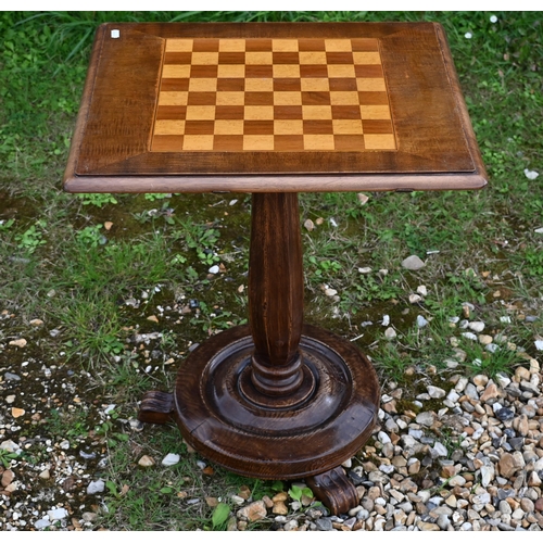 388 - A cast iron Victorian style greenhouse heater body with veined marble travertine top, to/w a chess b... 