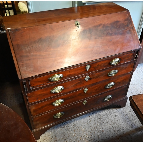 401 - A George III mahogany bureau with fitted interior over four long graduated drawers on shaped bracket... 